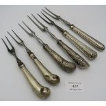 A collection of six 18th century two pronged dinner forks with silver handles. Condition report: Two