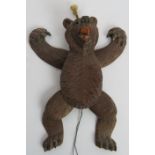 A late 19th/early 20th century well carved Black Forest dancing bear toy with glass eyes