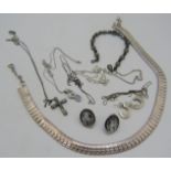 An assortment of items to include a silver boxed necklace, approx weight 33.8 grams, a cross set