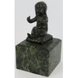A 19th century bronze figure of a young child mounted on a green marble base. Height 20cm. Condition