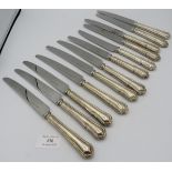 A set of six silver handled dinner knives and matching dessert knives, Sheffield 2000, makers RC.