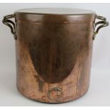 A large vintage heavy copper cooking pot with rivetted handles and tight fitting lid. Height 40cm.