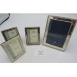 A collection of four small modern silver photograph frames, all fully hallmarked, approx 4" x 3" and