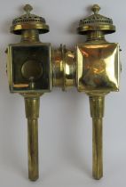 A good quality pair of 19th century brass carriage lamps with oil burners, bevelled glass sides