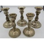 A set of three silver candlesticks, approx 5" high, London 1995, 1997 & 2000 and a pair of silver