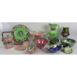 A collection of 13 pieces of hand decorated Maling pottery including a biscuit barrel, jug,