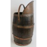 A coopered oak copper bound coal scuttle/stick stand with folding handle. Height 54cm. Condition