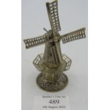 A white metal model of a windmill with detachable top, Dutch silver marks to base, moveable sails,