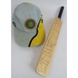 A 1999 cricket world cup India signed mini cricket bat and signed World Cup cap, includes Sachin