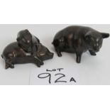 A set of three patinated brass pig ornaments, largest 16cm long. (3). Condition report: Light wear.