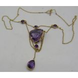 A superb amethyst and fine gold drop necklace, the centre amethyst approx 24 x 24mm, with four