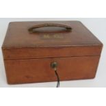 An antique leather bound document box with gold blocked initials 'M.C.' to lid, full leather