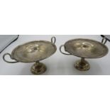 A pair of silver handled pedestal bon bon dishes, Chester 1912, height approx 3", weighted.