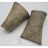 Two Far Eastern 19th century white metal betel leaf containers, heavily embossed with mythical