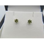 A pair of rare green Mali garnet ear studs. The backs 18ct yellow gold, boxed. Condition report: