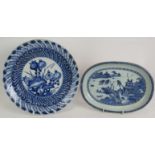 An 18th century Chinese porcelain charger with blue and white decoration over a relief moulded base,