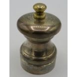 A silver 'Peter Piper' salt grinder, London 1991, approx 3" high, boxed. Condition report: Slight