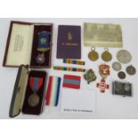 A collection of military and civic medals including two WWI victory medals, an Imperial Service