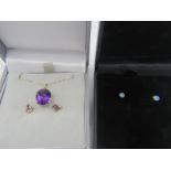 A oval amethyst & yellow metal pendant on a fine 9ct gold chain, amethyst approx 10mm x 8mm, a