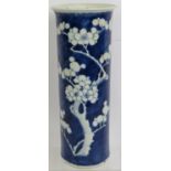 An antique Chinese porcelain sleeve vase with blue and white prunus decoration. Height 26cm.