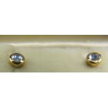 A pair of 18ct yellow gold stud earrings set with cabochon cut aquamarine, approx weight 1.7