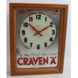 A vintage 1950s Craven 'A' cigarettes advertising mirror clock with Smith's Sectric movement mounted