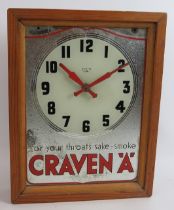 A vintage 1950s Craven 'A' cigarettes advertising mirror clock with Smith's Sectric movement mounted