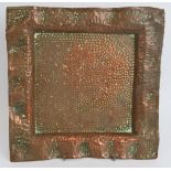 A square copper Arts & Crafts dish with planished decoration and wavy rim. Stamped Perry Son & Co