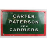 An early 20th century enamel advertising sign for 'Carter Paterson & Co Ltd Carriers' mounted on a