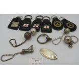 A collection of twelve various key rings, mainly sport related, all stamped 925 or fully