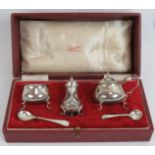 A five piece silver cruet set in Fortnum and Mason fitted box, hallmarked Chester 1934, Jay