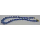 A blue graduated chalcedony necklace interspersed with small yellow metal beads, a 14ct yellow