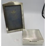 A Walker & Hall silver photograph frame, Sheffield 1931, 8 1/2" x 5 1/2" and a silver engine