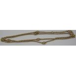 An unmarked yellow metal chain link necklace with eight openwork spacers. Approx 30" long, approx