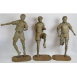 Set of three vintage Asian carved hardwood figures of athletes in various poses, each mounted on