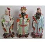 A set of 3 finely decorated 20th century Chinese porcelain figures representing health, wealth and