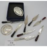 A collection of eight modern silver trowel shaped bookmarks and two golf related silver bookmarks,