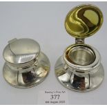 A pair of silver inkwells with glass liners, Birmingham 2000 and 2003. Condition report: Slight