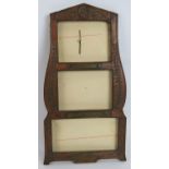 A hand carved fruitwood triple picture frame commemorating Napoleon Bonaparte and bearing plaques '
