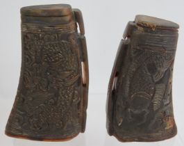 A pair of Chinese carved buffalo horn libation cups one with dragon designs and one with koi carp.
