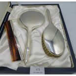 A silver dressing table set comprising of hand mirror, brush & comb, Birmingham 2003, boxed.