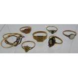A collection of seven gold & yellow metal rings to include two 9ct gold signet rings, a shield