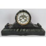A late 19th century green marble and slate Napoleon style striking mantel clock with French movement