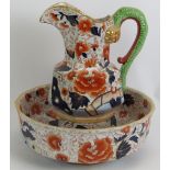 A large Ironstone toilet jug and bowl set decorated in Imari colours and with a dragon form