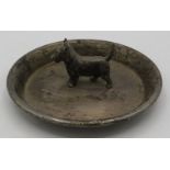 A silver dish with a Scottie dog in the centre, London 1922, approx weight 3.4 troy oz/107 grams.