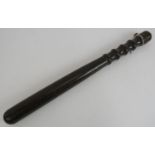 A vintage ebony police truncheon with part leather strap. Length 40cm. Condition report: Strap