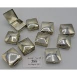 A collection of ten small modern square silver pill boxes, all hallmarked or marked 925, approx