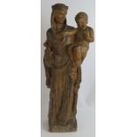 A large antique French plaster figure of the Madonna and Child finished in a wood style painted