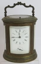 A good quality 19th century gilt brass repeater carriage alarm clock in ovoid engraved case. No