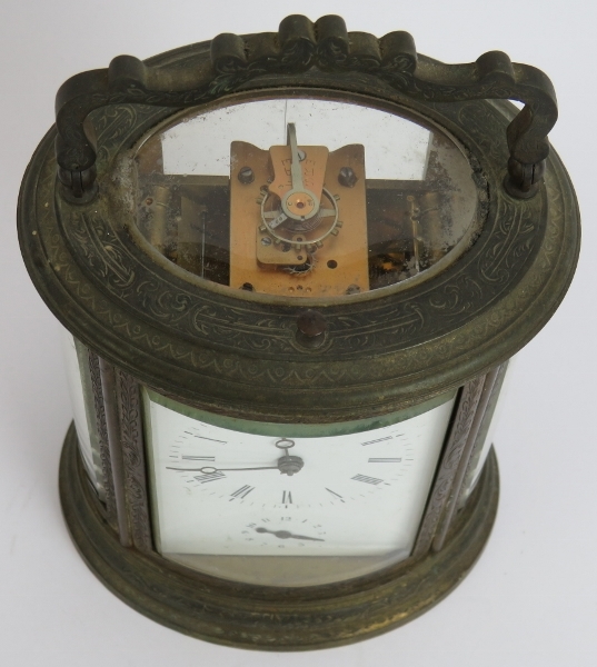 A good quality 19th century gilt brass repeater carriage alarm clock in ovoid engraved case. No - Image 2 of 7